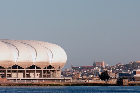 PORT ELIZABETH - APRIL 20 2010:South Africa will host the next soccer world cup. The north end lake with the beautiful new Porth Elizabeth stadium dedicated to Nelson Mandela, in porth elizabeth , South のeditorial素材