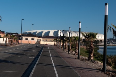 PORT ELIZABETH - APRIL 20 2010:South Africa will host the next soccer world cup. The north end lake with the beautiful new Porth Elizabeth stadium dedicated to Nelson Mandela, in porth elizabeth , South のeditorial素材