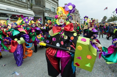 VIAREGGIO, ITALY - FEBRUARY 27: Man smiling in carnival mask, during the famous Carnival of Viareggio February 27, 2011 in Viareggio, Italyのeditorial素材