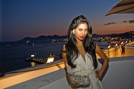 CANNES, FRANCE - MAY 17: British actress and designer  Fagun Thakrar (bag by Fagun Collection) attends the "Politics Of Love" Cocktail Party on May 17, 2011 in Cannes, Franceのeditorial素材