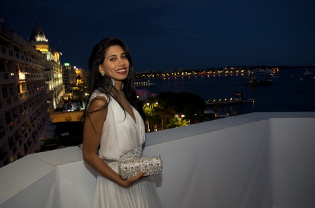 CANNES, FRANCE - MAY 17: British actress and designer  Fagun Thakrar (bag by Fagun Collection) attends the "Politics Of Love" Cocktail Party on May 17, 2011 in Cannes, Franceのeditorial素材