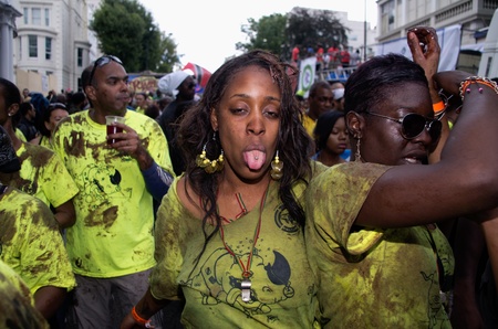 LONDON - AUG 28: member of chocolate nation group parades covered by choco sauce in the Notting Hill...