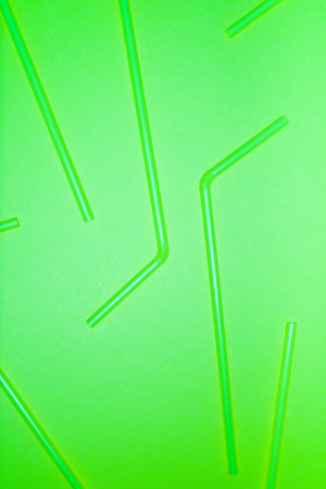 Abstrat background formed with multiple straws over a green flashy background, studio shot,  Texture theme.の写真素材