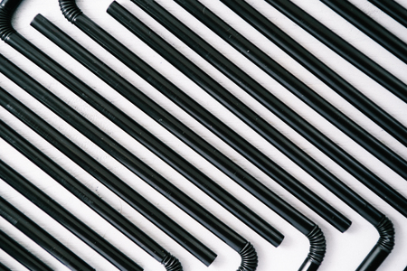 Abstrat background formed with multiple black straws. Texture theme.の写真素材