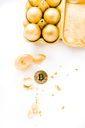 One old aesopus story  tells about the chick who makes the golden egg, in this case she makes bitcoin, conceptual composition for bitcoin and new economy, with golden eggs cracked with bitcoin outsideの写真素材