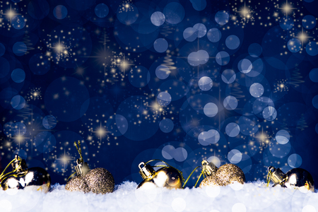 Small heart shaped  decoration on snow, against a beautiful holiday inspired background,  copy space leftの写真素材