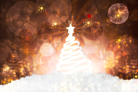 Christmas tree decoration on snow, against a beautiful holiday inspired background, poster format, copy space leftの写真素材