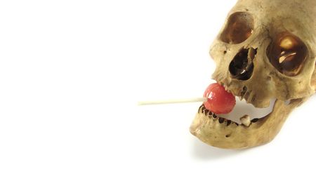 a halloween banner with skull and lollipopの写真素材