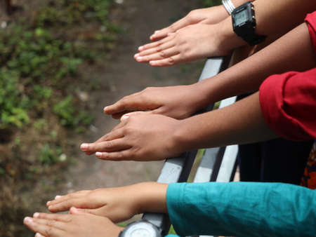 Hands of children held together, concept of unity, high angle viewの写真素材