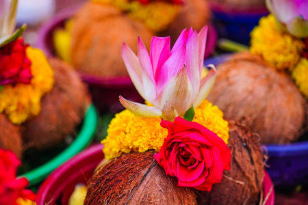 Close up of coconuts and flowers in the market, Thailand.