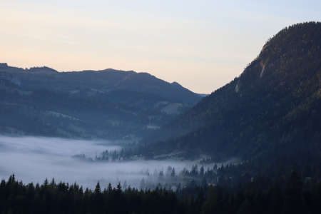 Morning fog in the Carpathians mountains, landscape, Red Lake area, Romaniaの写真素材