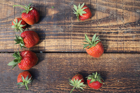 Strawberries on a wooden background. Top view. Copy space.の写真素材