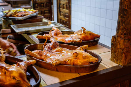 Roasated suckling pig served traditionally at a Spanish restaurantの写真素材