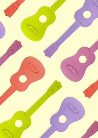 Purple, pink, green and orange cutouts of guitars on isolated pastel yellow background. Colorful music pattern. Card or wallpaper concept. Abstract blues, jazz, rock or folk texture. Minimal flat lay.の写真素材