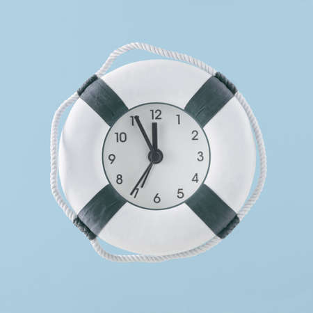 Minimal creative abstract summer vacation concept. Lifebelt with clock on isolated pastel blue...
