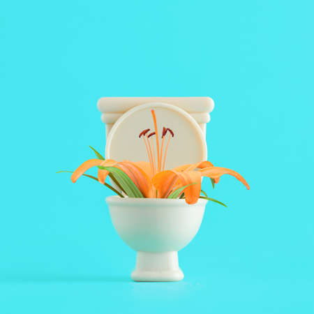Orange lily flower in beige toilet on isolated vivid turquoise-blue background. Minimal spring or...