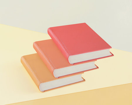 Stairs with ocher orange and red books on isolated pastel yellow and beige background. Concept of successful schooling, learning, reading, education and personal development.の写真素材