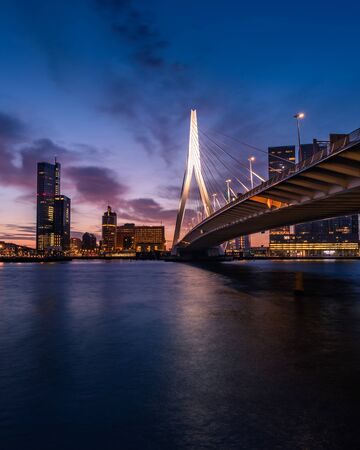 Sunrise at Rotterdam, the Netherlands, looking over the river that crosses the city.の写真素材