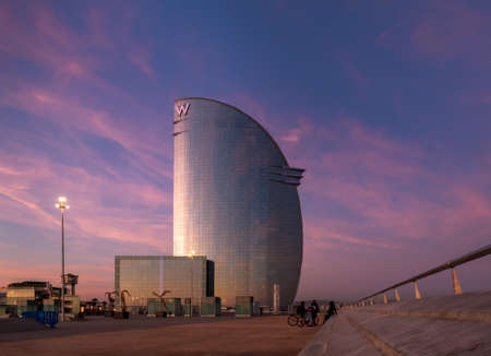 Barcelona, Spain - Februari 10 2020: The W Barcelona Hotel during sunset, is located in the Barceloneta district of Barcelona, in the expansion of the Port of Barcelona.のeditorial素材