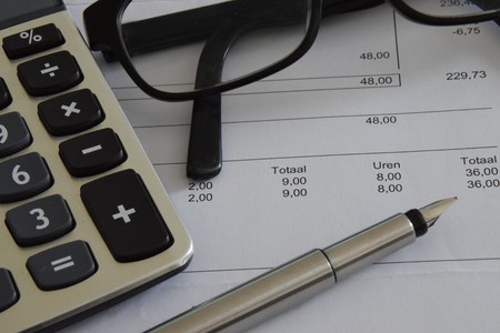 Calculator pen and glassesの写真素材