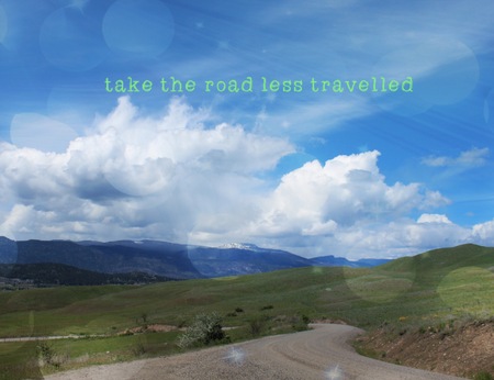 Conceptual landscape view with inspirational quote. Take the road less travelled. Lighting effects.の写真素材