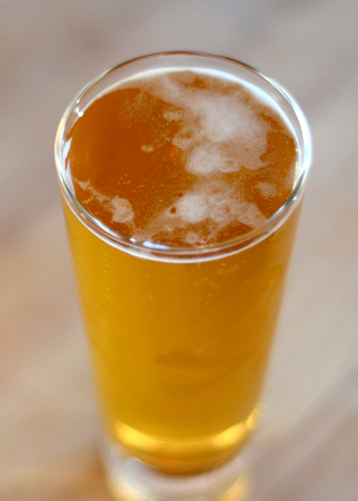 Beer in a pint glass.