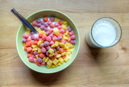 Bowl of breakfast cereal with a glass of milk