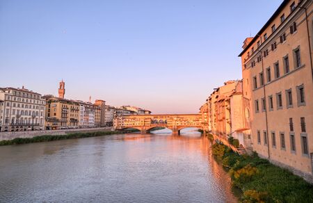 A view of the Arno River and the Ponte Vecchio in Florence, Italy.の写真素材