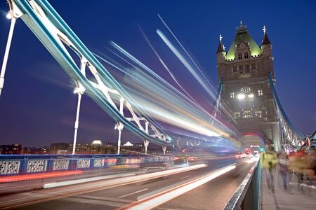 Vehicles pass over Tower Bridge across the River Thames in London, UK.の写真素材