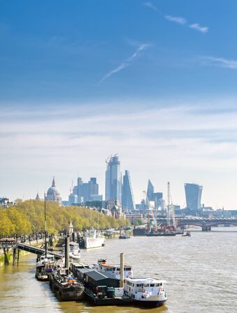 A view along the River Thames on a sunny day in London, UK.の写真素材