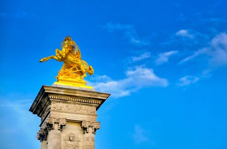 A view of the Pont Alexandre III bridge that spans the Seine River in Paris, Franceの写真素材