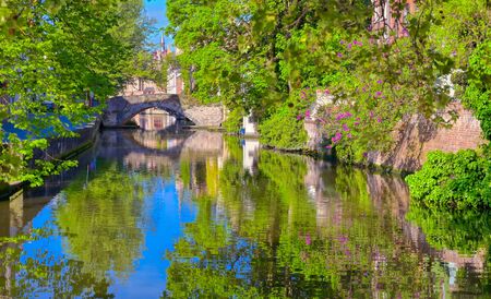 The canals of Bruges (Brugge), Belgium on a sunny day.の写真素材