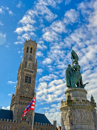 The Jan Breydel and Pieter de Coninck statue located in the historical city center and Market Square (Markt) in Bruges (Brugge), Belgium on a sunny day.のeditorial素材