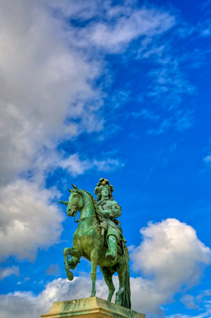 Versailles, France - April 24, 2019: Louis XIV statue just outside of the gates of Versailles Palace on a sunny day outside of Paris, France.のeditorial素材