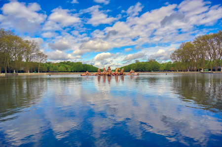 Versailles, France - April 24, 2019: Fountain of Apollo in the garden of Versailles Palace on a sunny day outside of Paris, France.のeditorial素材