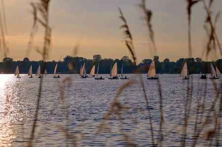 Views along the Kralingse Plas lake at sunset in Rotterdam, the Netherlands.