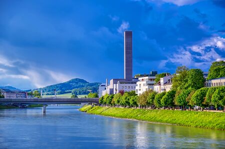 A view of the Austrian city of Salzburg along the Salzach River.の写真素材