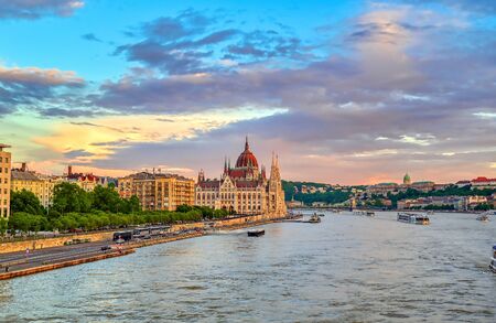 The Hungarian Parliament Building located on the Danube River in Budapest Hungary at sunset.の写真素材