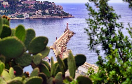 The lighthouse at the Port of Nice on the Mediterranean Sea at Nice, France along the French Riviera.の写真素材