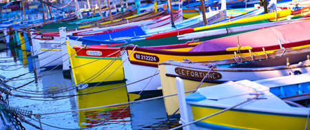 Nice, France - June 08, 2019 - Fishing boats docked in the port along the French Riviera on the Mediterranean Sea at Nice, France.のeditorial素材