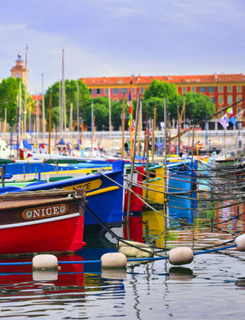 Nice, France - June 11, 2019 - Fishing boats docked in the port along the French Riviera on the Mediterranean Sea at Nice, France.のeditorial素材
