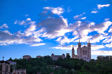 The Basilica of Notre Dame de Fourviere overlooking Lyon, France and the Saone River.の写真素材