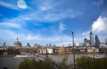 A view across the River Thames to St. Paul's Cathedral and the skyline of London, UK.の写真素材