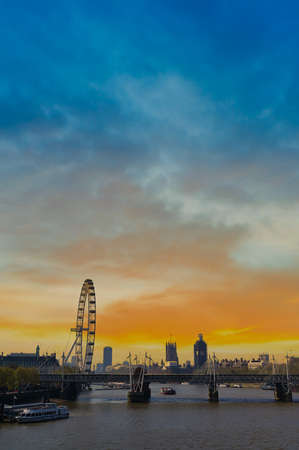 A view along the Thames in London, UK at dusk.の写真素材