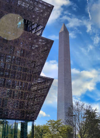 Washington, D.C. - October 14th, 2021: The Smithsonian's National Museum of African American History and Culture on the National Mall with the Washington Monument.のeditorial素材