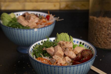 Homemade salmon, wakame, edamame, avocado, bean sprouts and rice poke. Hawaiian cuisine.の写真素材