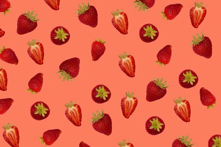 Composition with delicious ripe strawberries on pink background. Strawberries pattern isolated