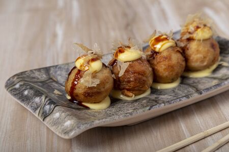 Japanese food Takoyaki octopus balls on wooden backgroundの写真素材