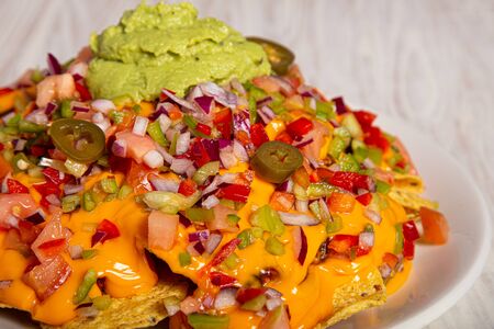Homemade nachos with vegetable salad hash and guacamole. Closed imageの写真素材