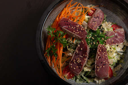 Salad bowl with tuna tataki. Asian cuisine. View from aboveの写真素材